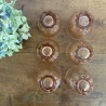 Verres anciens et carafe en verre rose